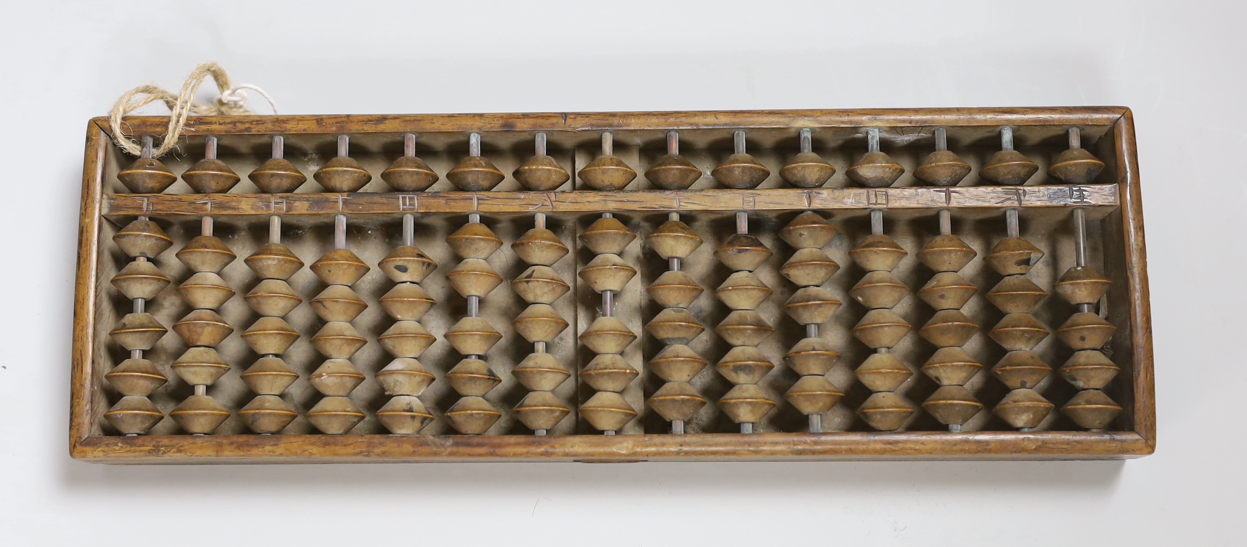 A Chinese abacus, 34cm long