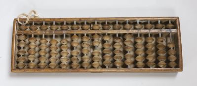 A Chinese abacus, 34cm long