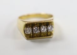 A modern 18ct gold and four stone diamond set dress ring, size Q/R, gross weight 10.6 grams.