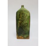 A 19th century green glazed terracotta Sgraffito flask, 19cm