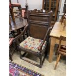An oak Wainscot type chair (reduced in height), width 56cm, depth 55cm, height 110cm
