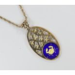 A 1970's pierced 9ct yellow gold and enamel sign of the zodiac oval pendant depicting Cancer,