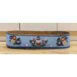 A 19th century Greek painted bentwood trough, decorated with multicoloured flowers on a mid blue