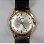A gentleman's early 1970's 9ct gold manual wind wrist watch, retailed by Garrards, with case back