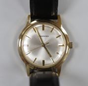A gentleman's early 1970's 9ct gold manual wind wrist watch, retailed by Garrards, with case back