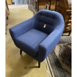 A contemporary blue fabric armchair, width 81cm, depth 74cm, height 84cm