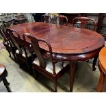 A Chinese hardwood extending dining table, length 244cm extended, two spare leaves, width 110cm,