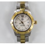 A lady's modern steel and gold plated Tag Heuer Aquaracer quartz wrist watch, with mother of pearl