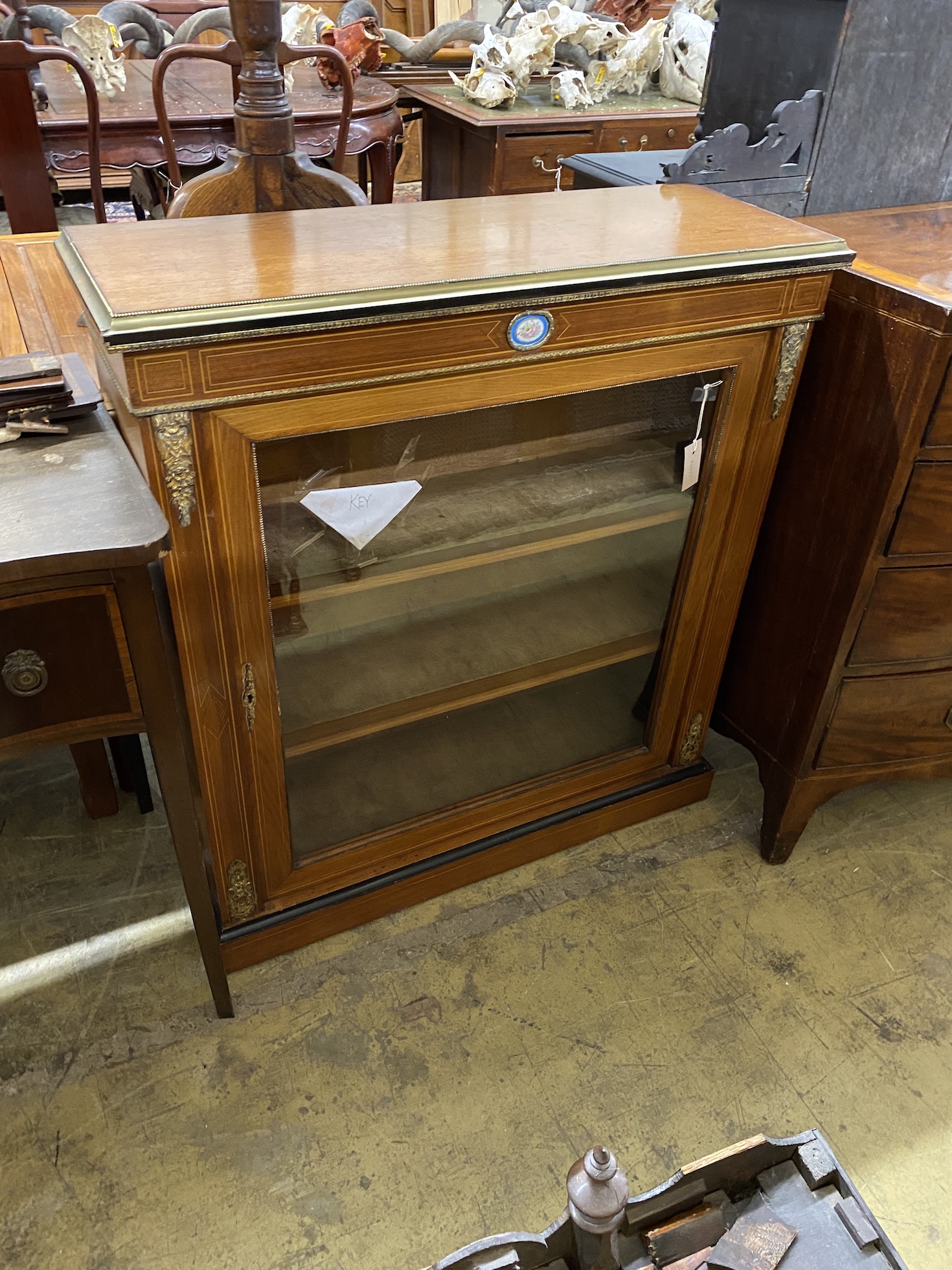 A late 19th century French porcelain and gilt metal mounted pier cabinet, width 92cm, depth 34cm,