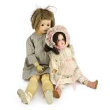 An unusual composition headed doll, German, circa 1900, indistinctly impressed 46, with open