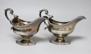 A pair of George VI silver pedestal sauceboats, with gadrooned borders, S. Blanckensee & Sons Ltd,