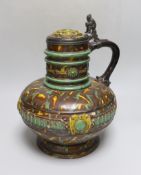 A German earthenware flagon, 32cm tall