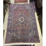 An Isphahan red ground rug, 206 x 133cm together with a Bokhara red ground runner