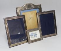 A group of four assorted modern silver mounted photograph frames, largest 27.9cm.