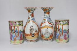 A pair of 19th century Cantonese famille rose porcelain brushpots, decorated with figural scenes,