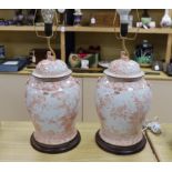 A pair of Chinese style iron red porcelain table lamps