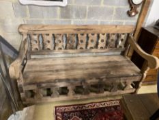 A carved hardwood settle from reclaimed boat timbers, length 191cm, depth 83cm, height 107cm