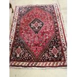 A Hamadan red ground rug, 174 x 124cm
