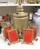 A brass tea urn and two pairs of brass photo frames, tallest 50cm