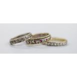 An 18ct and diamond set full eternity ring, size O, gross 2.9 grams, a 9ct and diamond chip set half