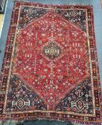 A Hamadan red ground carpet, 294 x 216cm