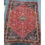 A Hamadan red ground carpet, 294 x 216cm