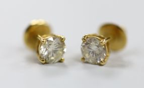A pair of yellow metal and solitaire diamond set ear studs, gross weight 2.9 grams, each stone