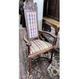 A set of four early 20th century French carved oak elbow chairs, width 59cm, depth 43cm, height