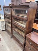 A pair of Edwardian two tier oak Lebus four section bookcases, width 89cm, depth 36cm, height 166cm