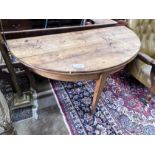 An early 19th century continental fruitwood D shaped folding tea table, width 124cm, depth 60cm,