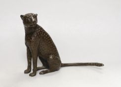 A small contemporary bronze seated leopard, stamped and dated 2000 to underside, 15cm high