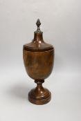 A 19th century turned mahogany urn and cover, 33cm