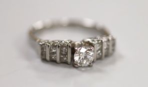 A modern 18ct white gold and single stone diamond ring, with three row graduated diamond set