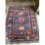 A North West Persian blue ground rug, 186 x 130cm
