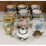 A group of Mocha ware, three various earthenware mugs, a Wemyss-style teapot, etc. (12)