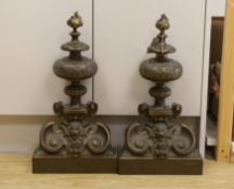 A pair of 19th century brass chenets, 50cm tall