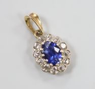 A yellow metal, sapphire and diamond set oval cluster pendant, 11mm, gross weight 1.6 grams.