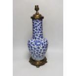 A 19th century Chinese blue and white ‘lotus’ vase, later converted into a brass lamp