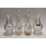 Two pairs of Victorian decanters, a silver wine label and three others