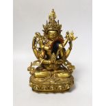 A Sino-Tibetan gilt bronze Buddha and consort, 23cm