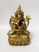 A Sino-Tibetan gilt bronze Buddha and consort, 23cm
