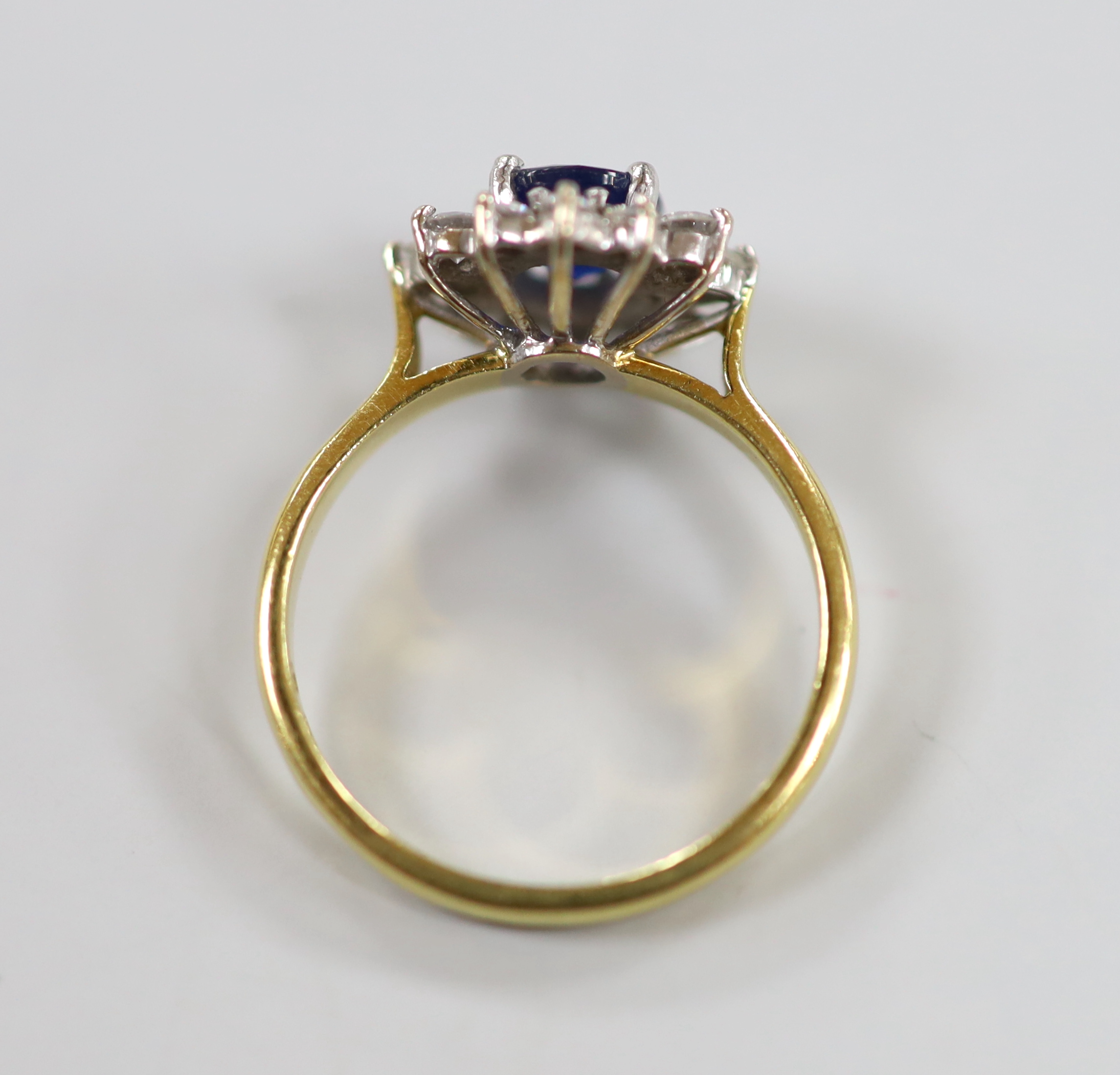 A modern 18ct gold sapphire and diamond set oval cluster ring, size J, gross weight 3.2 grams. - Image 3 of 3