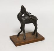 A small Chinese bronze figure of a standing deer, 13cm