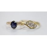 An 18ct and plat, singe stone diamond and two stone split pearl set crossover ring, size Q and a