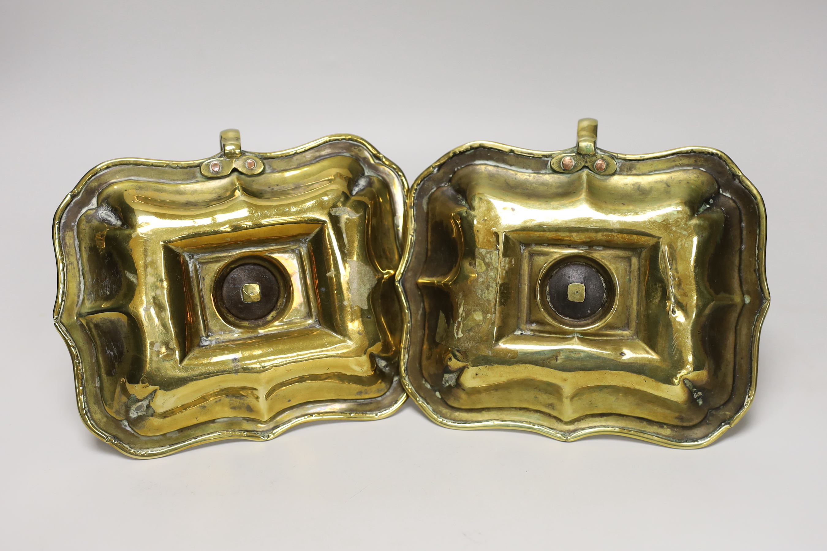 A pair of 18th century brass chamber candlesticks, the rectangular trays with wave edges, 18cm wide - Image 2 of 2