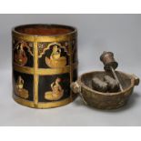 An African carved wood bowl, a Tibetan prayer wheel and a Persian waste basket