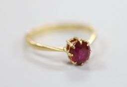 A 1960's 18ct gold and solitaire ruby set ring, size O, gross weight 2.2 grams.