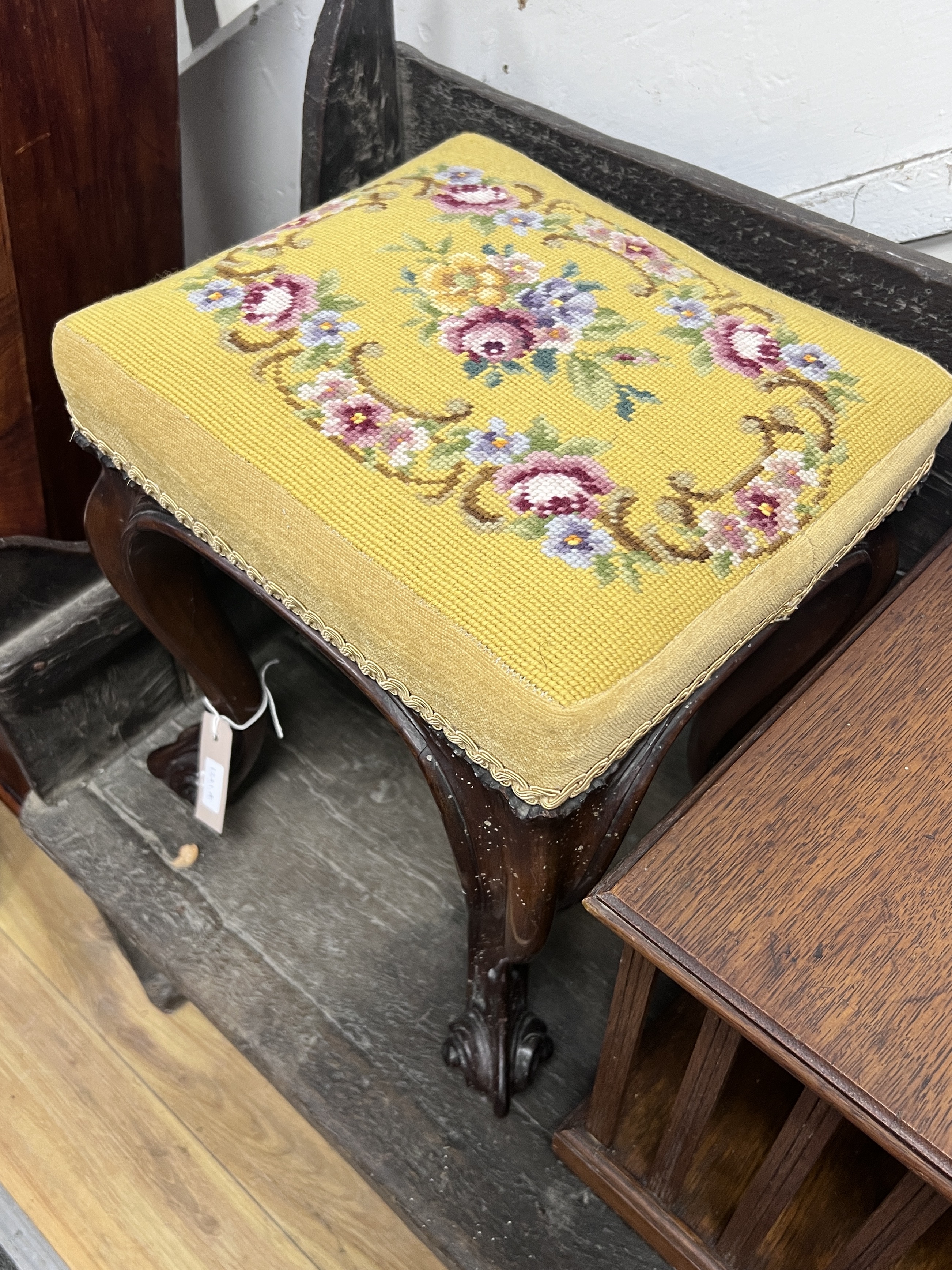 A Victorian carved mahogany footstool, width 32cm, height 40cm