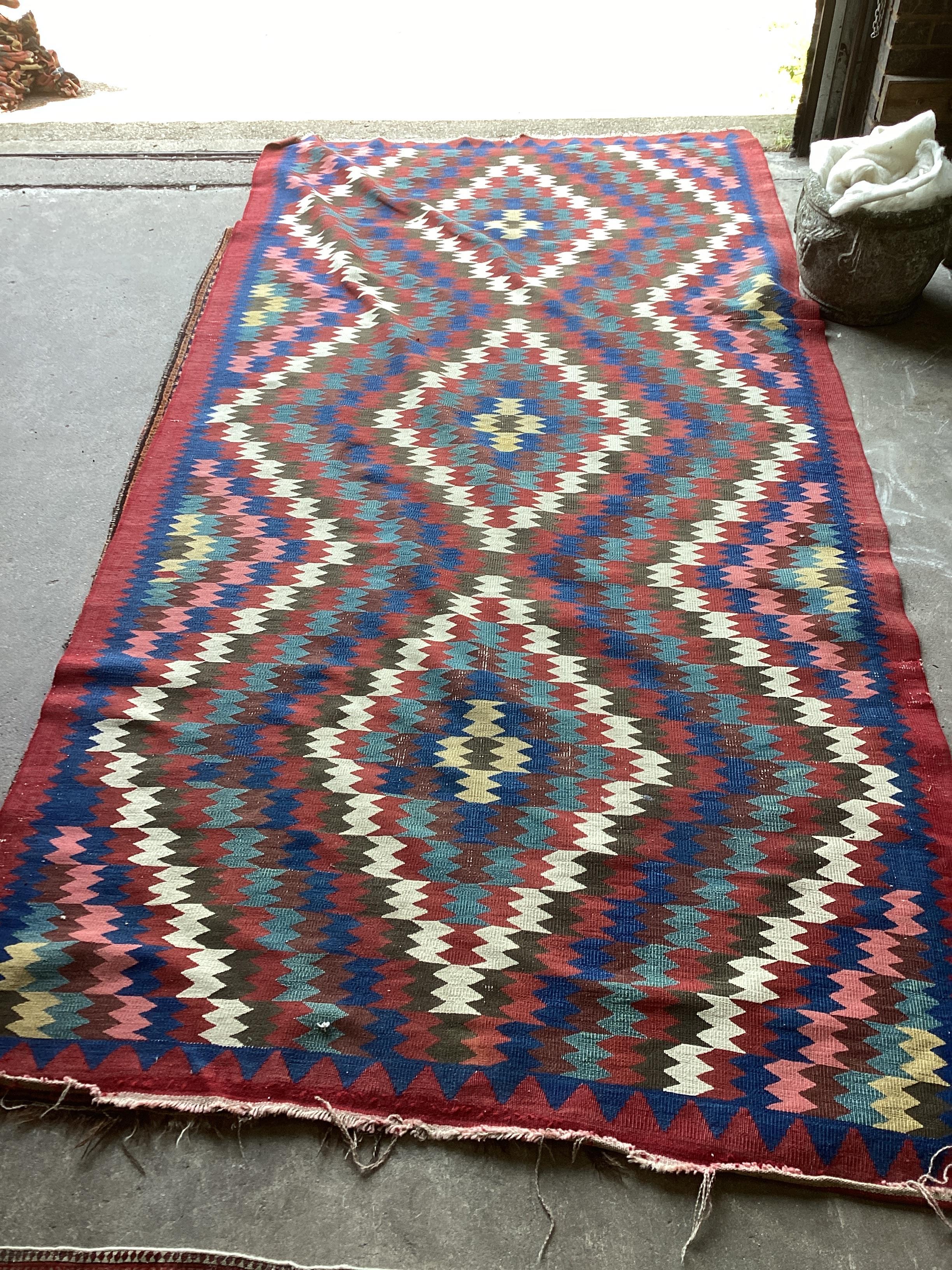 A Kelim polychrome flatweave carpet, approx. 320 x 160cm