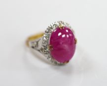 A yellow metal cabochon ruby and diamond chip set oval cluster ring, size M/N, gross weight 4.9
